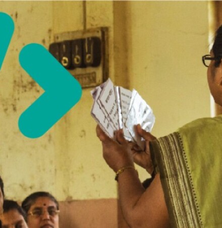 Women holding up cards