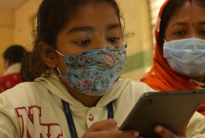 Girl looking at tablet